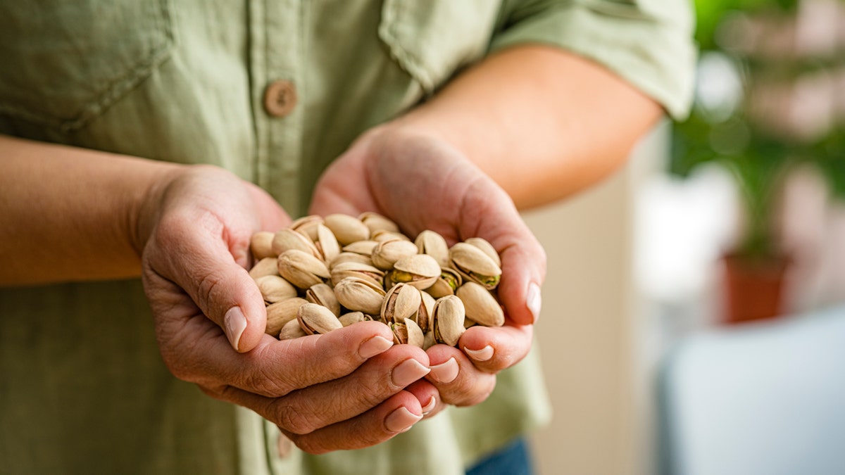 hand-holding-pistachios