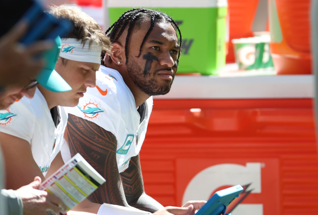 Dolphins quarterback Tua Tagovailoa on the bench