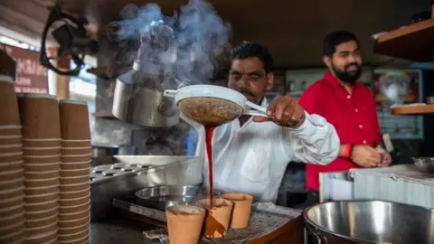 A busy Lucknow street with food stalls