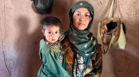 Mother and child in a household facing malnutrition