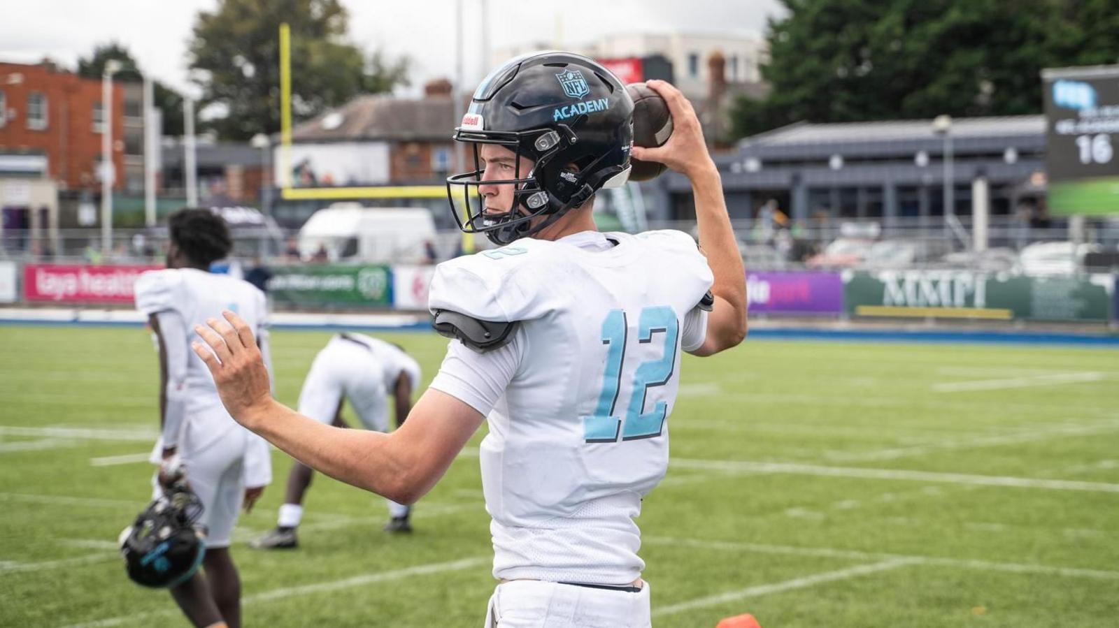 Fenton throwing a pass during practice