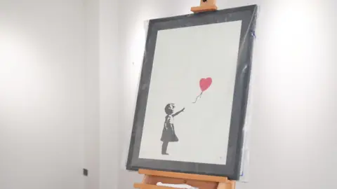 Builder cleared of burglary in Banksy art raid