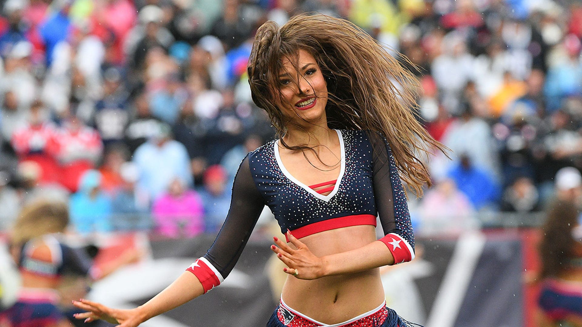 Cheerleaders perform before kickoff at Gillette Stadium