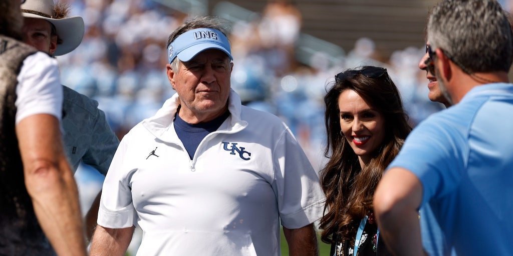 Bill Belichick and Jordon Hudson before the game