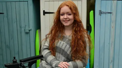 Passengers boarding a Translink Glider bus