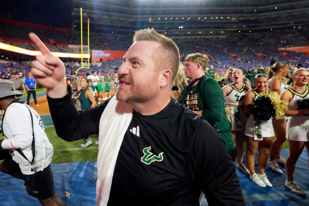 South Florida head coach Alex Golesh celebrates after the win
