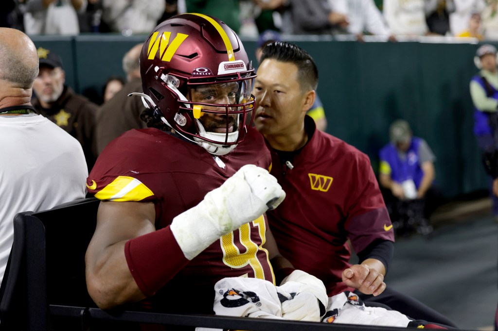 Wise taken off on a cart after being injured during the game at Lambeau Field