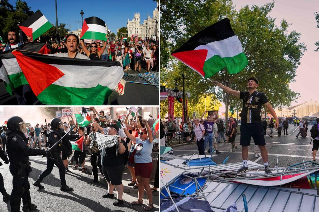 Spectators and protesters along the route as teams depart the circuit