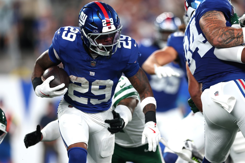 Tyrone Tracy Jr. runs during preseason action