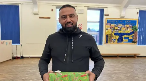 Takeaway owner delivers 1,000 gifts to local children this Christmas