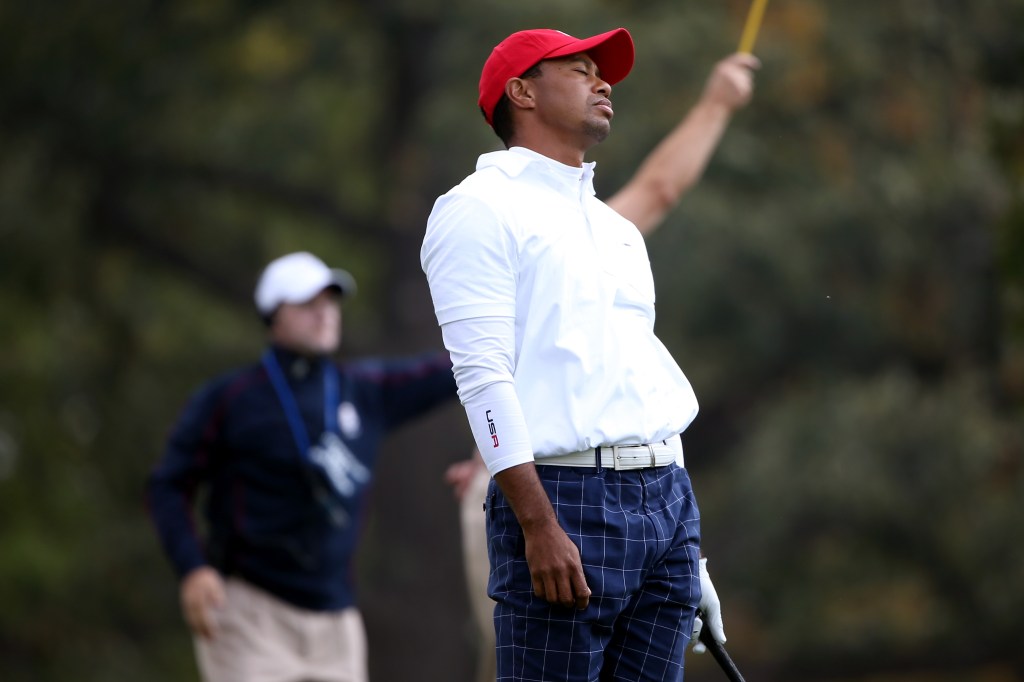 Tiger Woods reacts during a poor tee shot