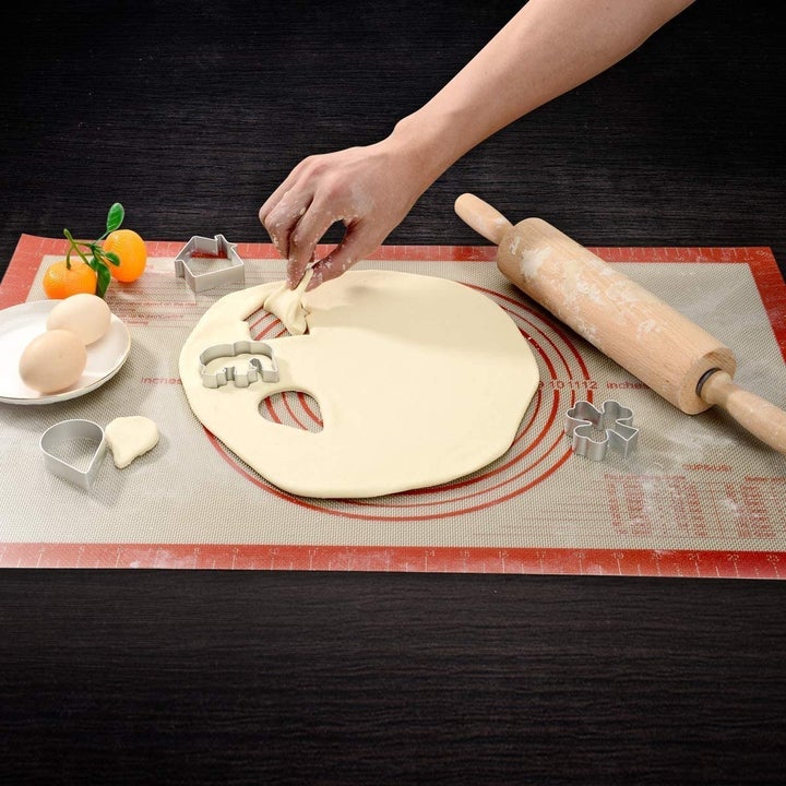 Dough being rolled on mat