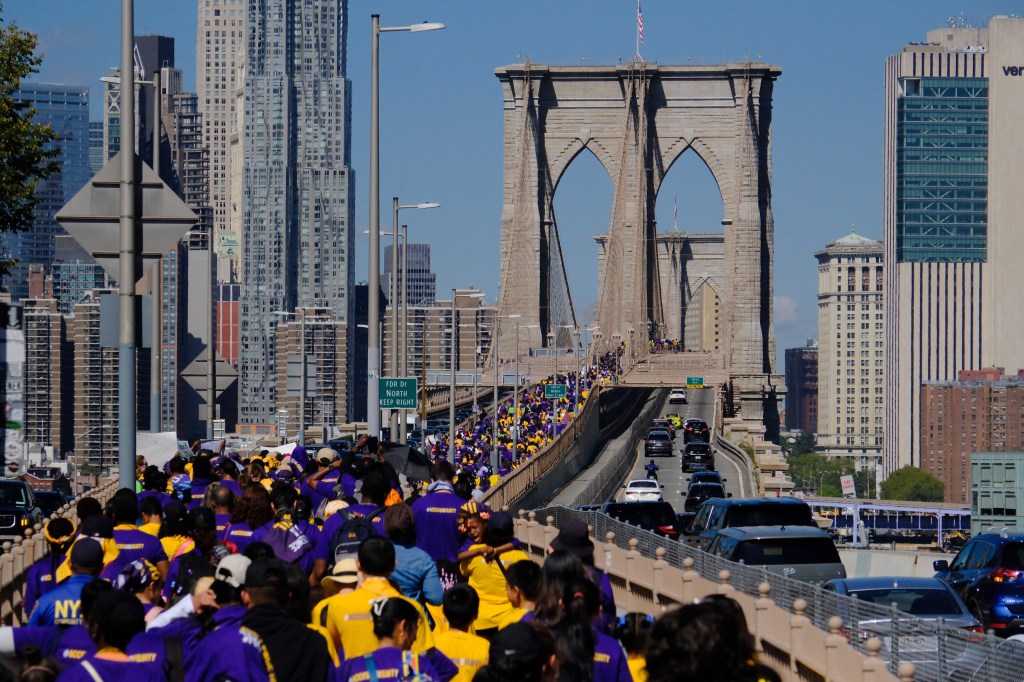 Rally participants with banners during the cross-Manhattan event