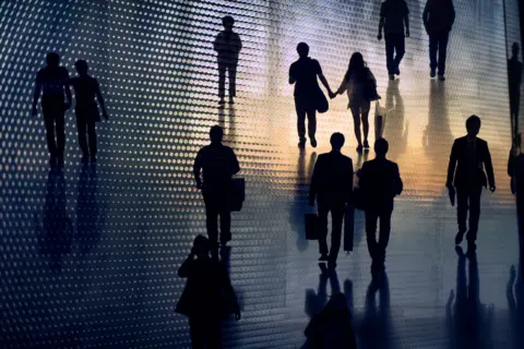 US payrolls revised down by 911,000 for year through March, Labor Department says