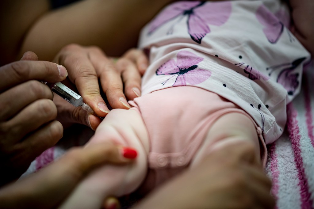 Pediatrician administers vaccination