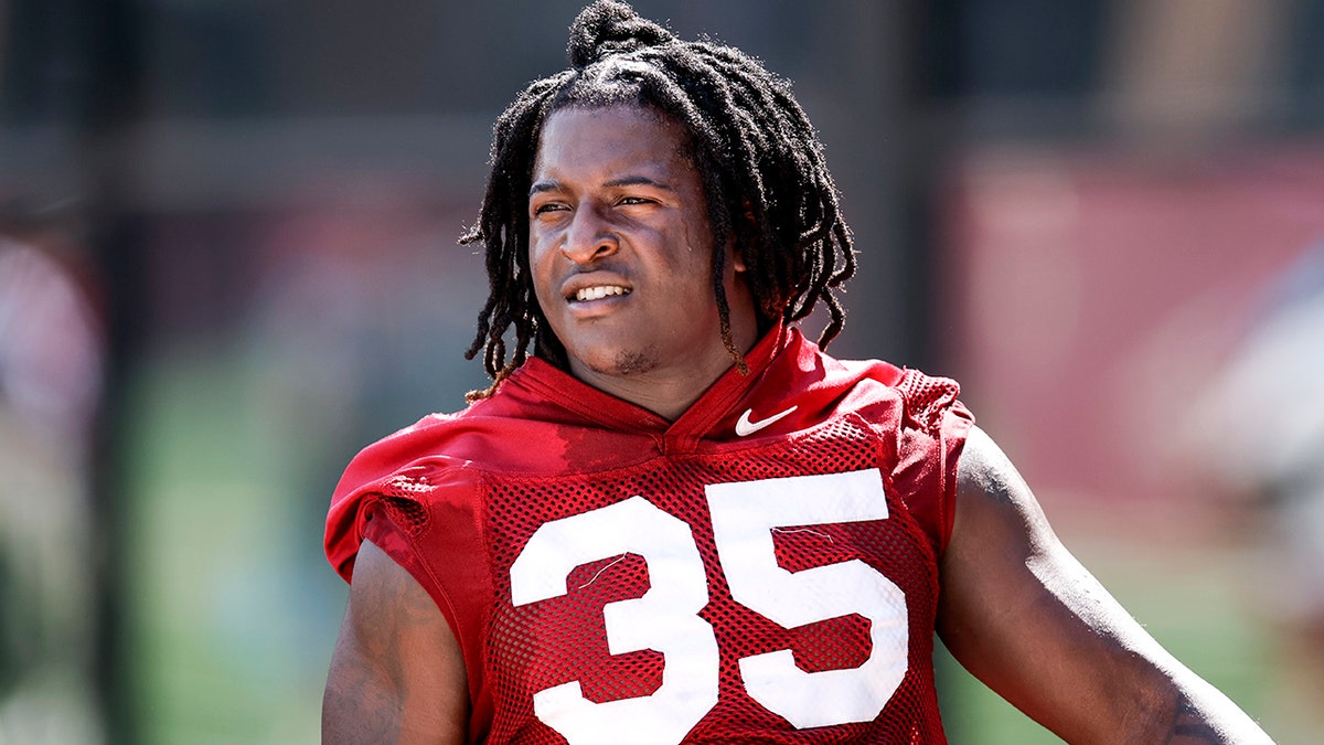 Players warm up in tribute shirts for Ethan Pritchard