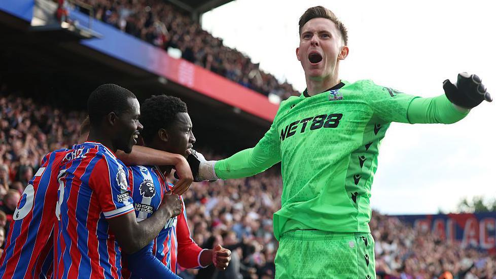Crystal Palace goalkeeper Dean Henderson celebrates after the win