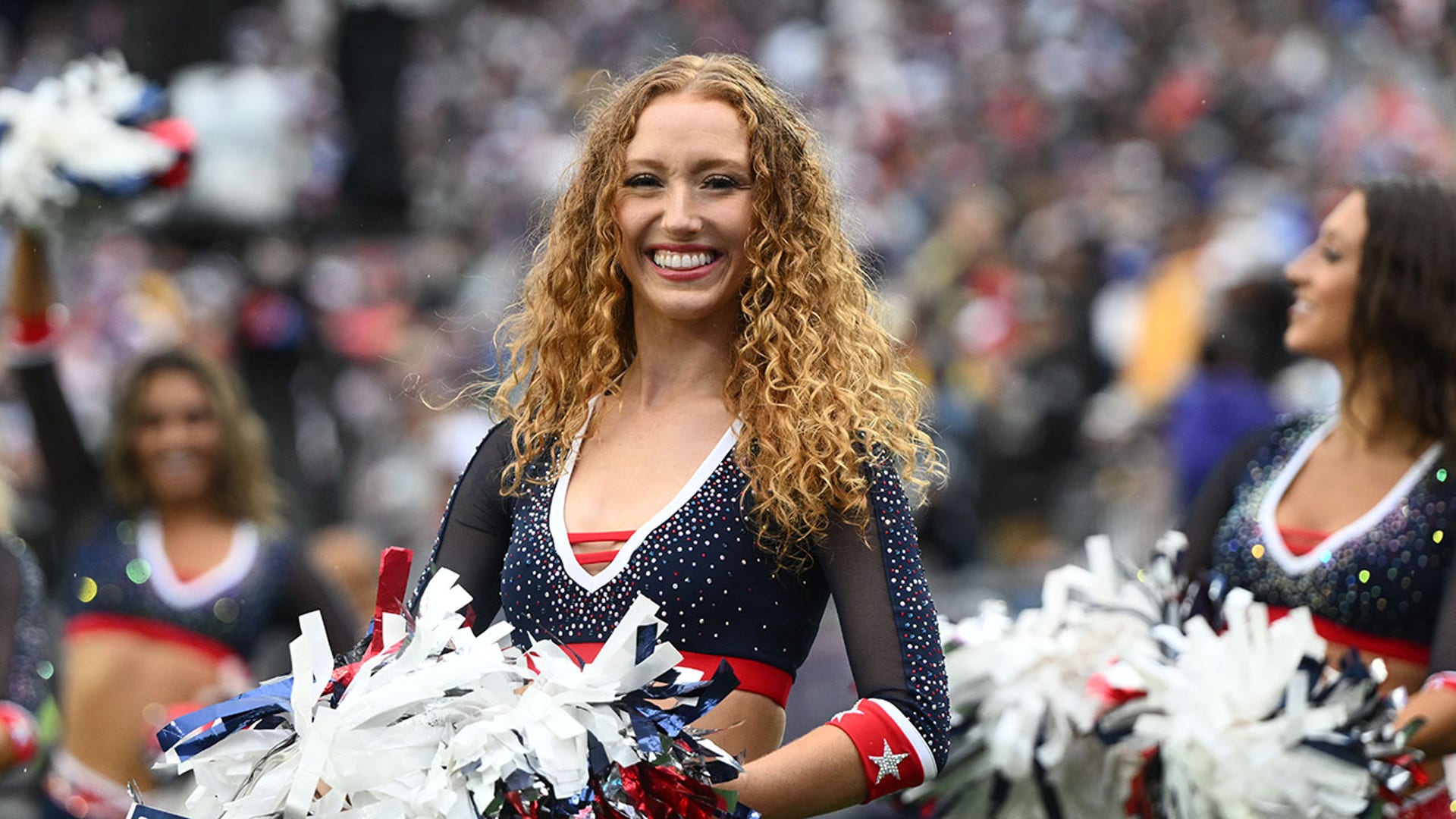 Cheerleaders smile and perform in the first half against the Las Vegas Raiders