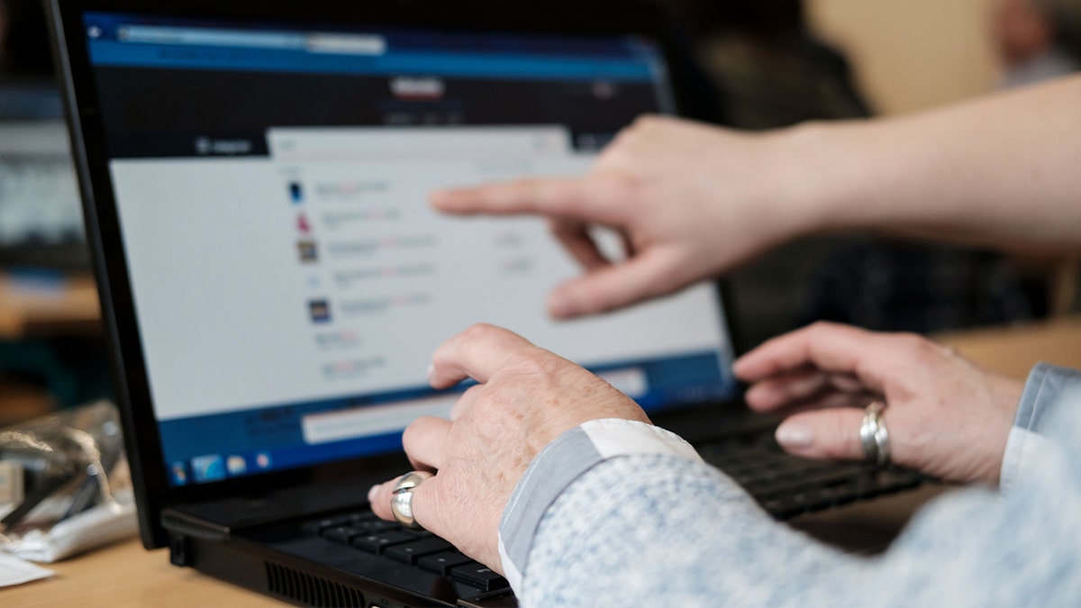 close-up of hands on a keyboard