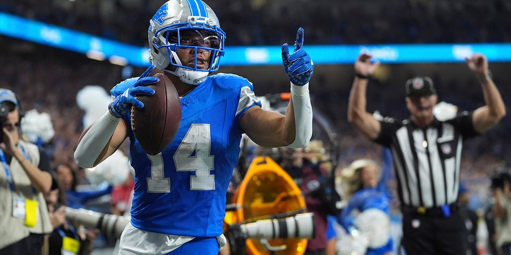 Amon-Ra St. Brown celebrates a touchdown for Detroit