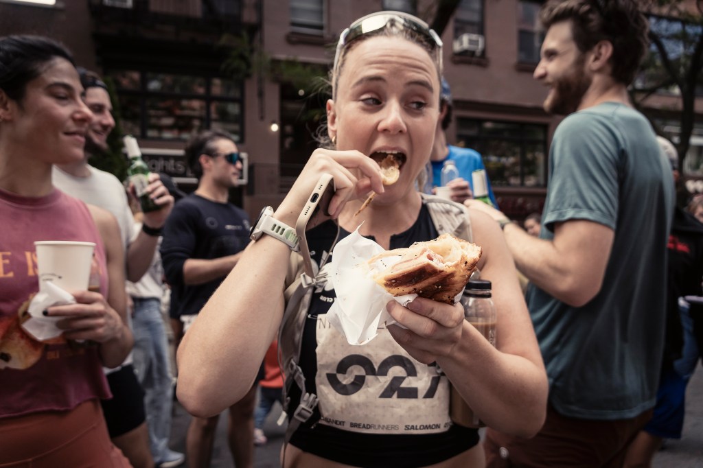 Runners approach a pastry stop