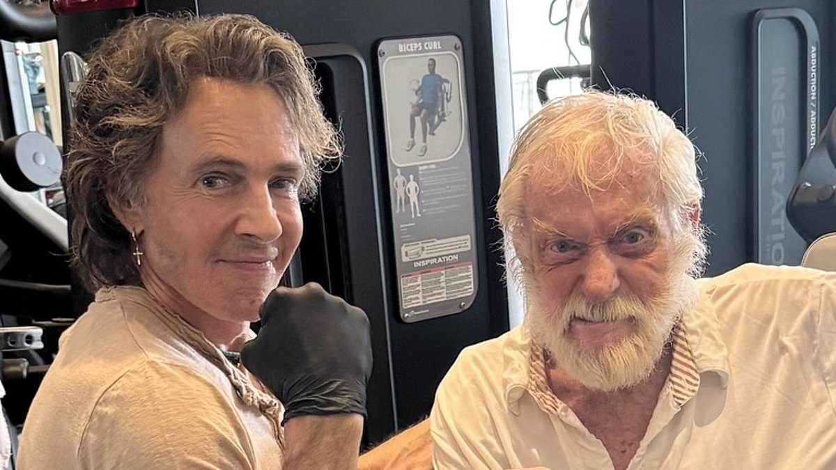 Dick Van Dyke, 99, flexes his muscles at the gym with unlikely celebrity pal