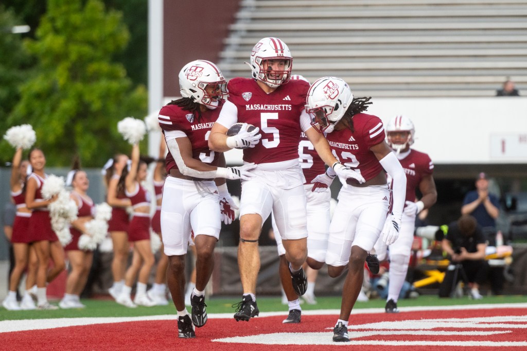 celebrates teammates scoring pick six