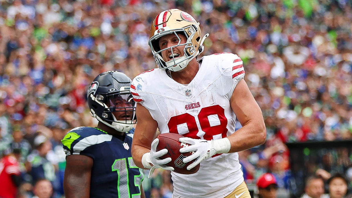 Jake Tonges reaches for the ball in the end zone