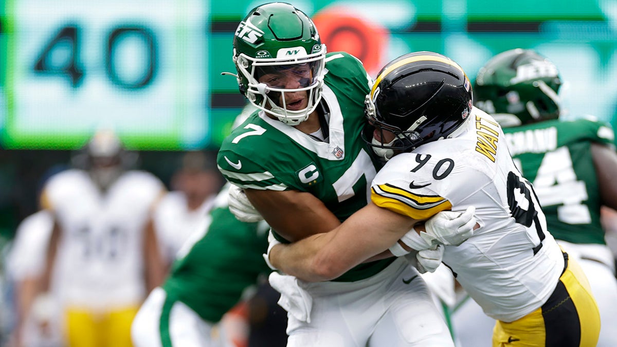 Justin Fields hit by T.J. Watt