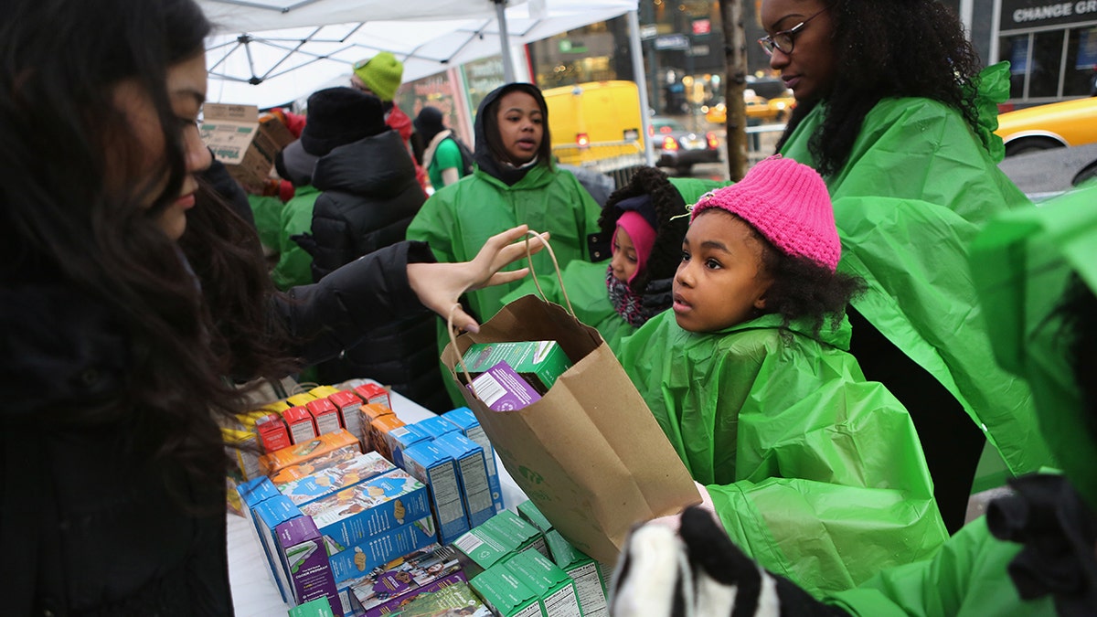 Girl Scouts selling cookies