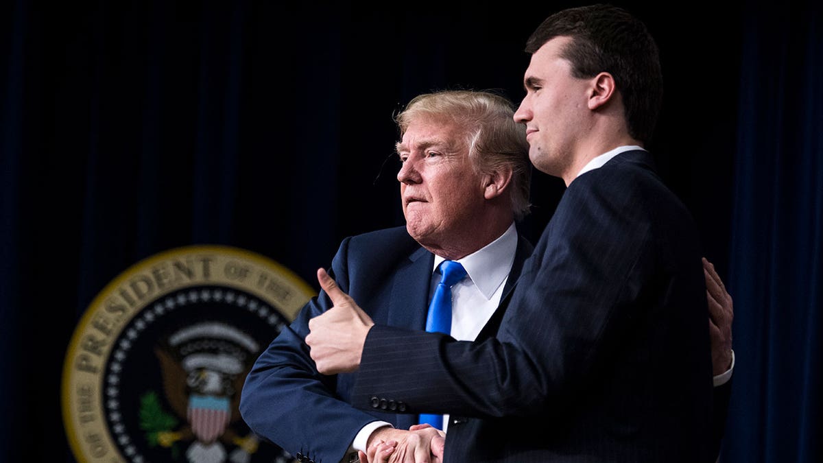 Trump and Charlie Kirk at an event
