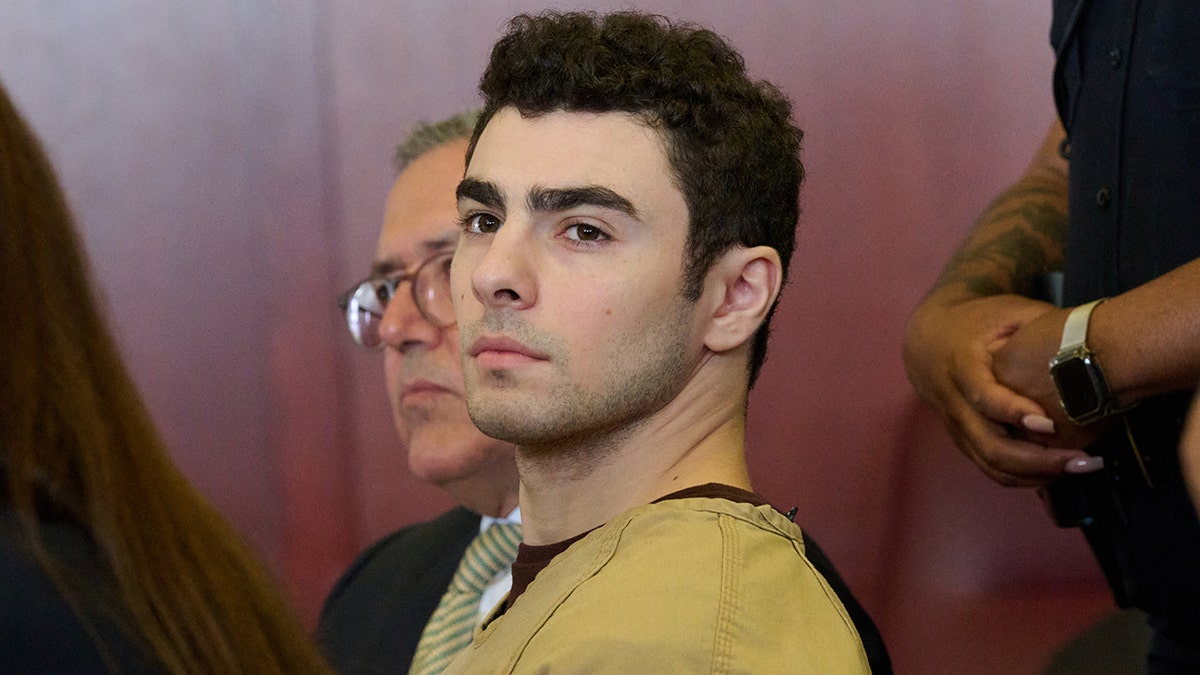 Luigi Mangione in court during terror charge drops