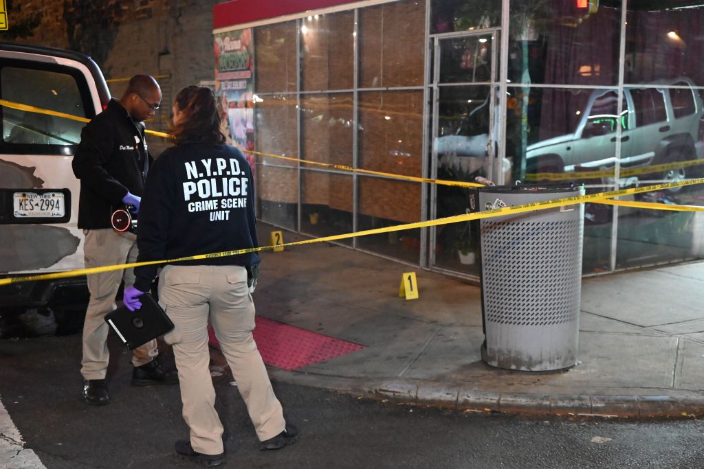 Image of police at the scene with investigators