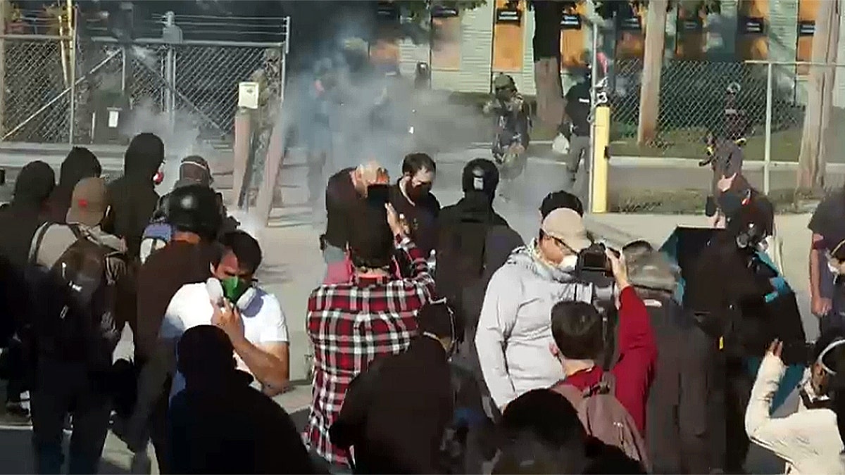 Smoke rising as federal officers push back protesters