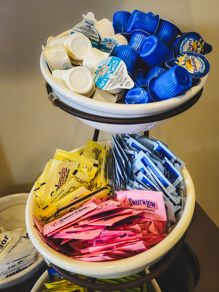 Tiered stand holding various single-serve items