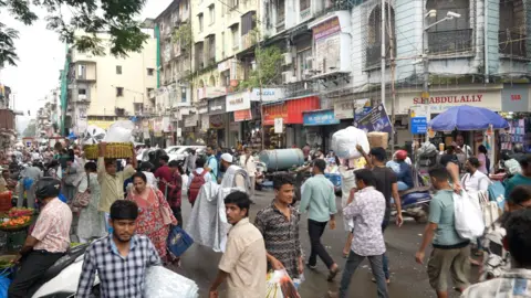 Wholesale hub with shopkeepers at Crawford Market