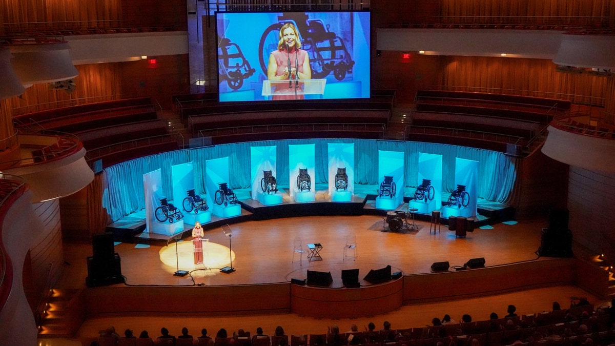 Candace Cameron Bure receives a wheelchair distribution