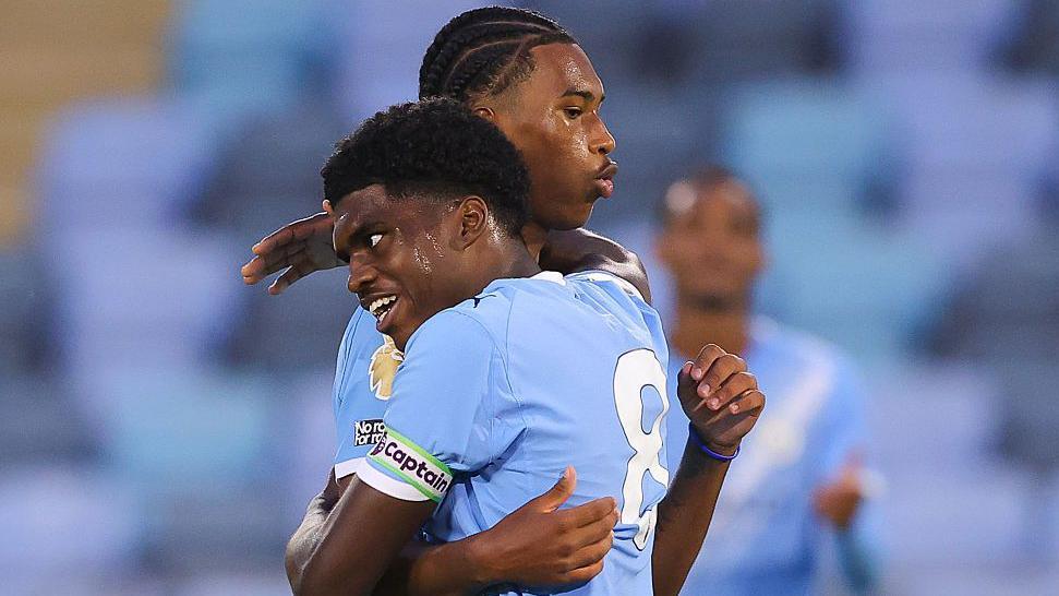 Heskey brothers debut for Manchester City as Foden leads Cup win at Huddersfield