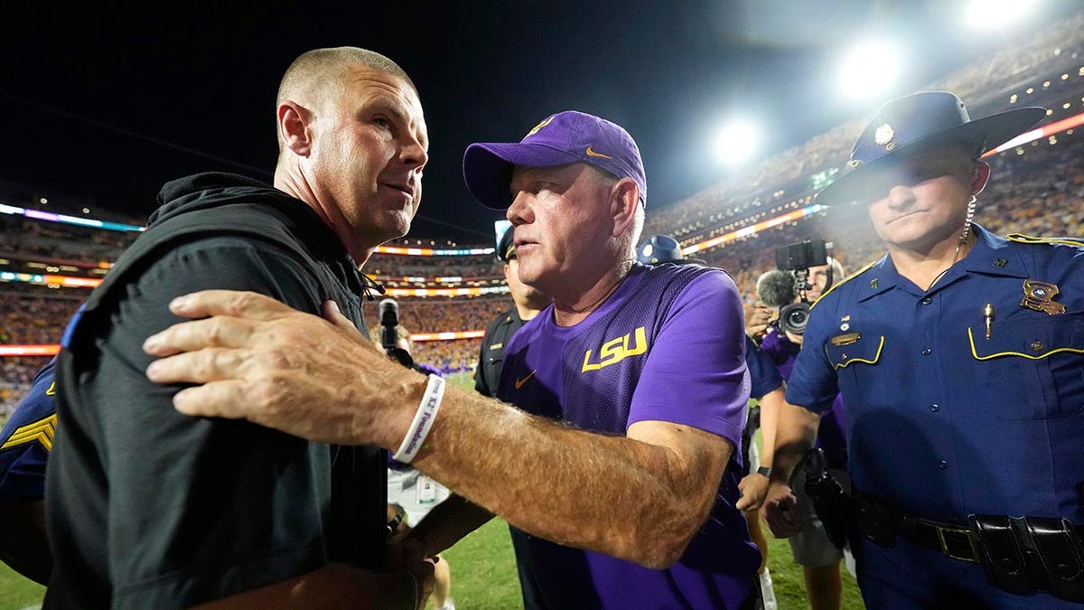 LSU head coach Brian Kelly greets Florida coach Billy Napier after the game