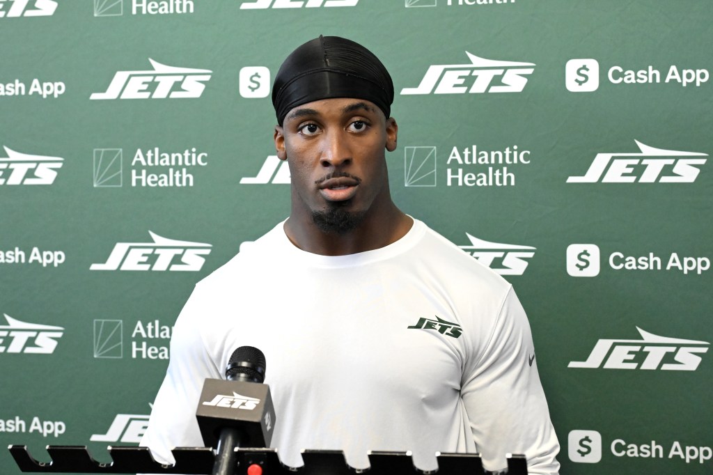 Jets running back Breece Hall speaks to the media