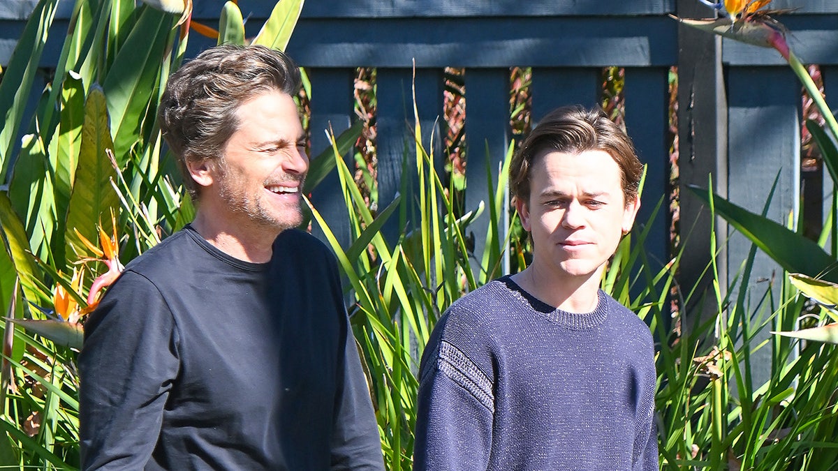 Rob Lowe walking with son John