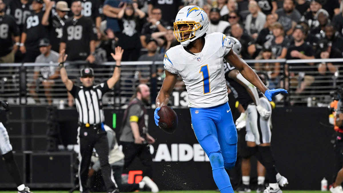 Quentin Johnston celebrates after scoring a touchdown