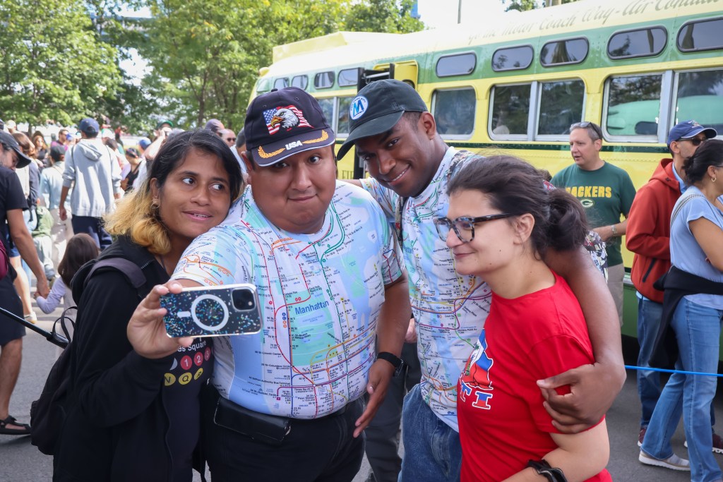 Vintage 1950s green-and-yellow bus on display