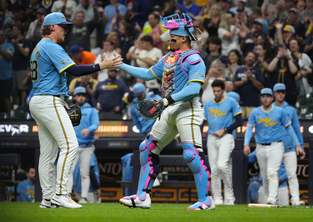 William Contreras celebrates after a home win over the Cardinals