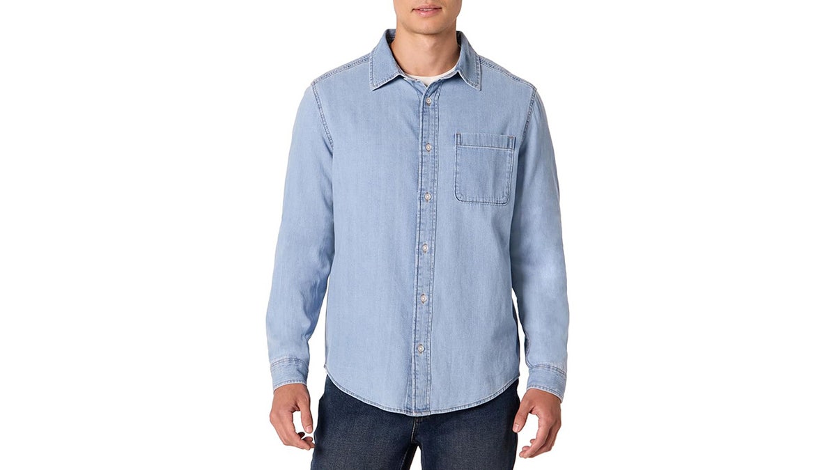 Men's denim button-down shirt on a neutral background