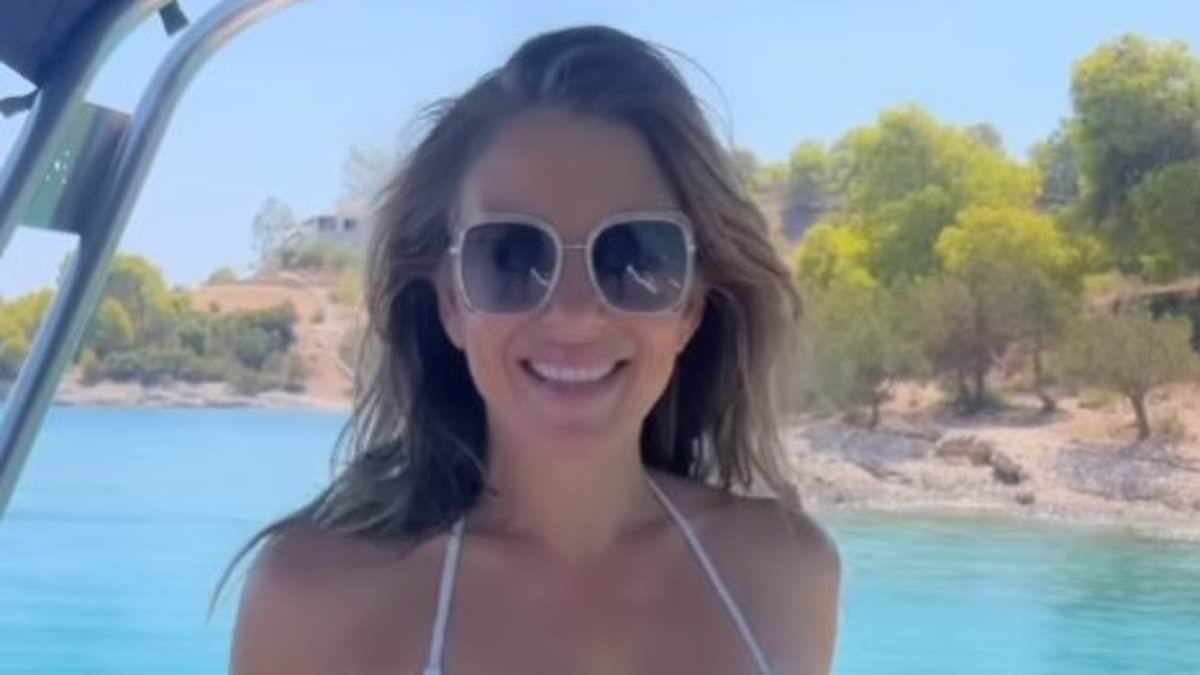 Elizabeth Hurley models white bikini on yacht to promote her swimwear line, hints at winter sun getaway