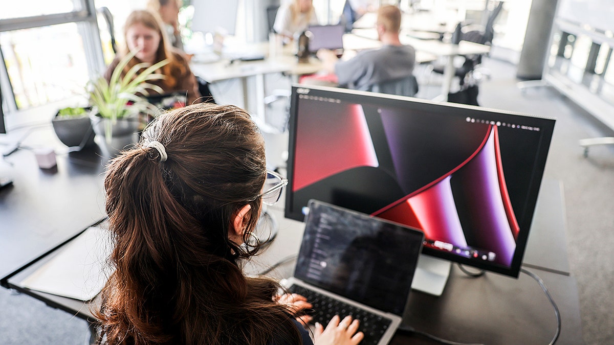 Person in an office working on a computer