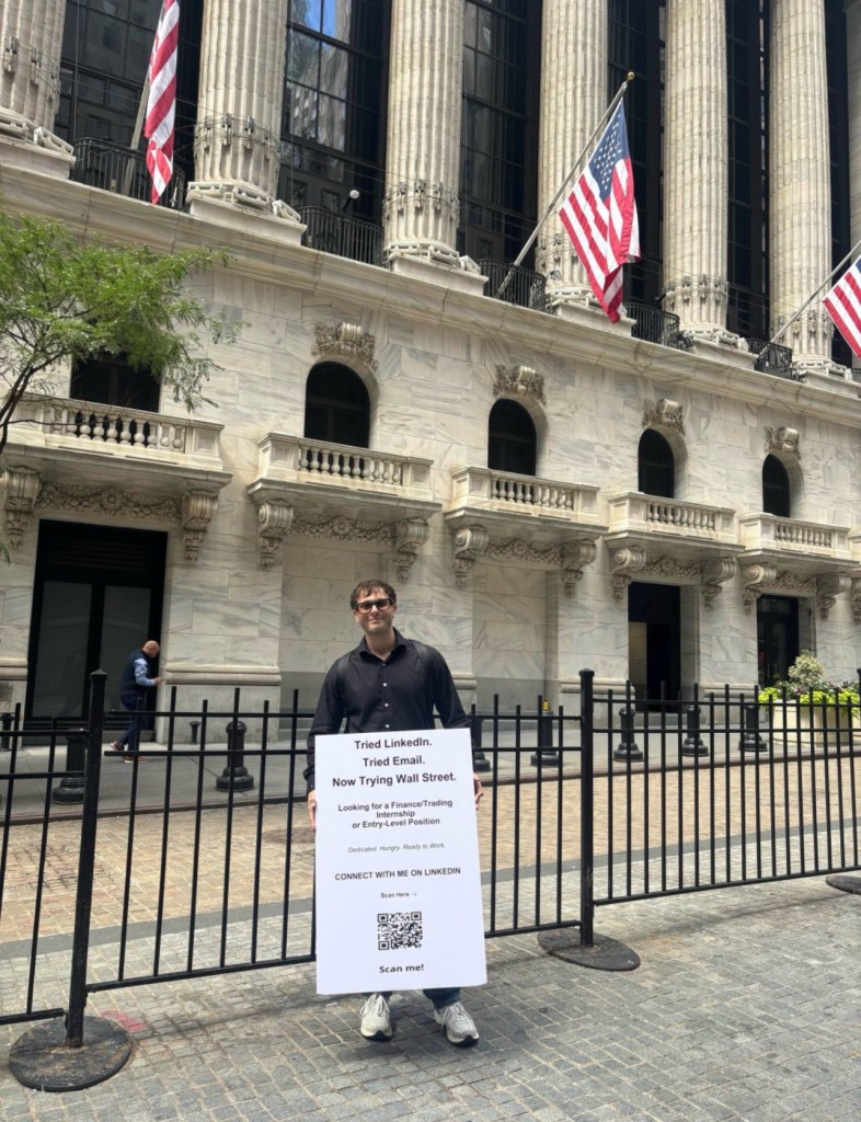 Florida Finance Graduate Carries 'Hire Me' Sign on Wall Street, Draws Interest from IPO Partner