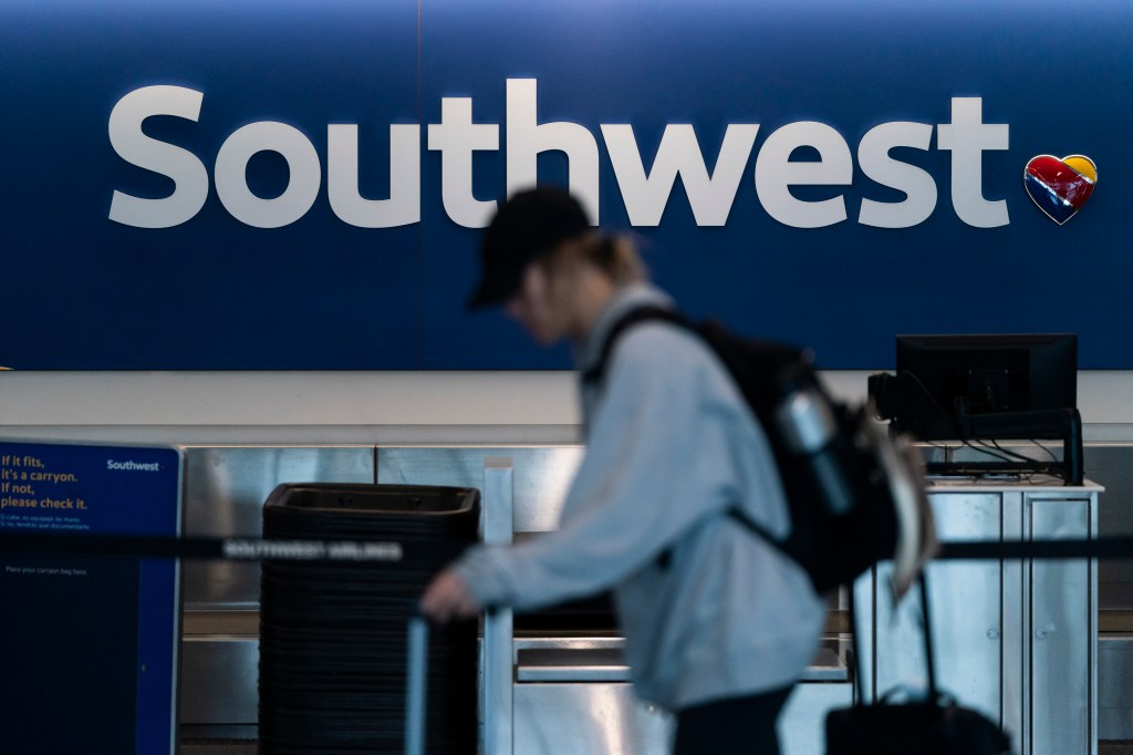 Traveler walks through a Southwest Airlines ticketing area