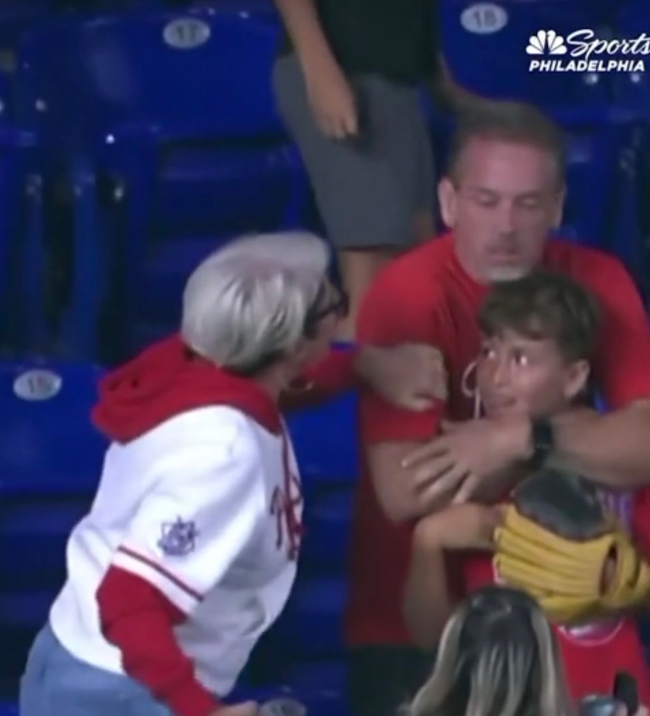 Woman confronts father over home run ball